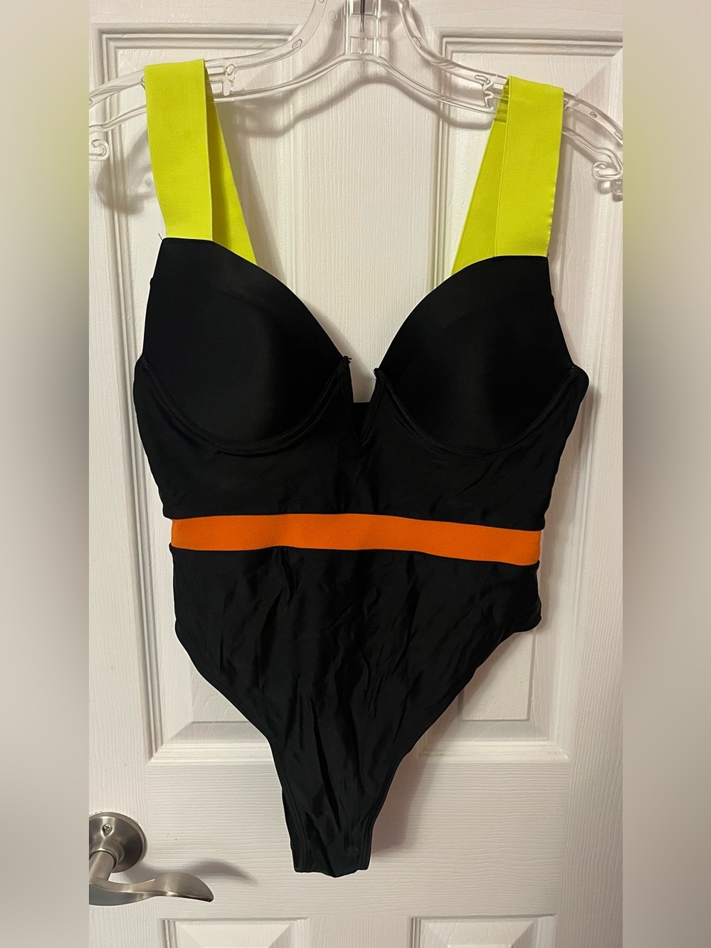 Black One-Piece Swimsuit with Neon Yellow Straps and Orange Waistband